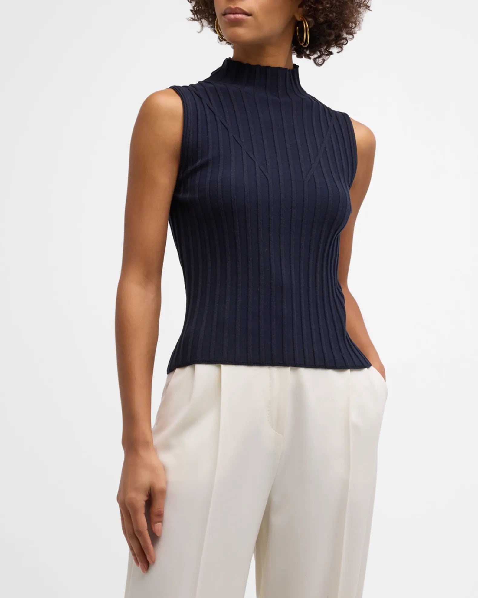 http://www.frockshoptx.com/cdn/shop/products/esma-ribbed-mock-neck-sleeveless-sweater-397171.webp?v=1702067512&width=2048